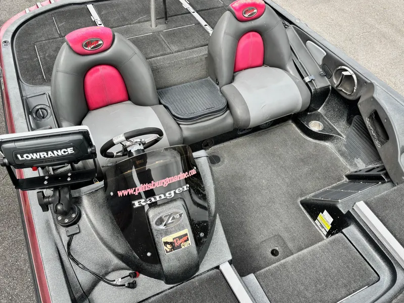 Slide: The Image of 2006 Ranger Z19 Comanche boat interior with Lowrance equipment and dual seats. - 6
