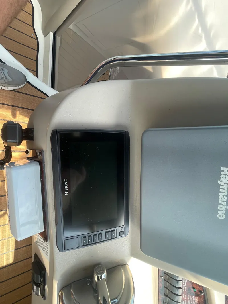 Slide: The Image of 2001 Sea Ray 340 Sundancer helm with Garmin and Raymarine navigation systems. - 8