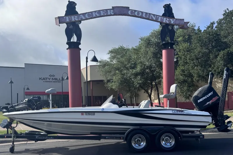 Slide: The Image of 2007 Triton Tr-20X HP DC boat on trailer near Katy Mills, Tracker Country sign. - 0