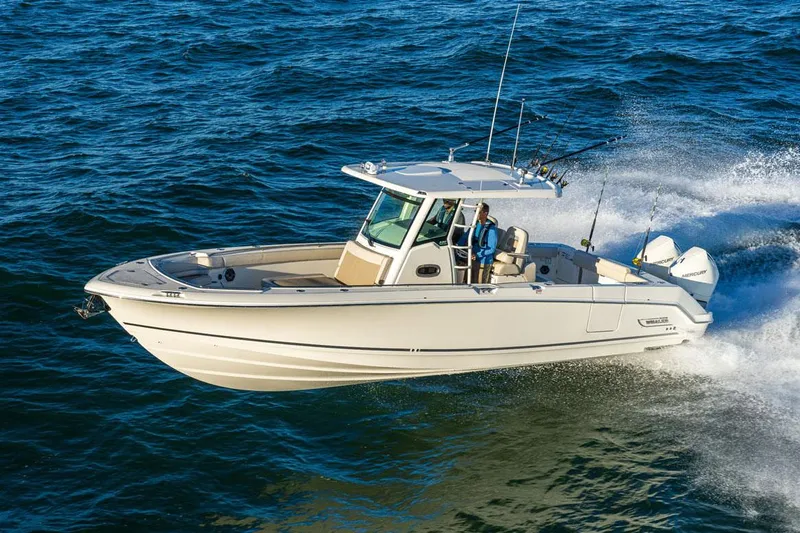 Slide: The Image of Manufacturer Provided Image: 2025 Boston Whaler 330 Outrage cruising on open water. - 13