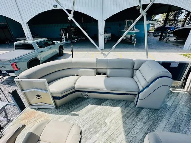 Slide: The Image of 2018 South Bay 525CPTR pontoon boat with spacious seating and modern design in a marina setting. - 11