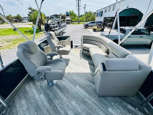 Slide: The Image of 2018 South Bay 525CPTR pontoon boat interior with plush seating and modern design. - 12
