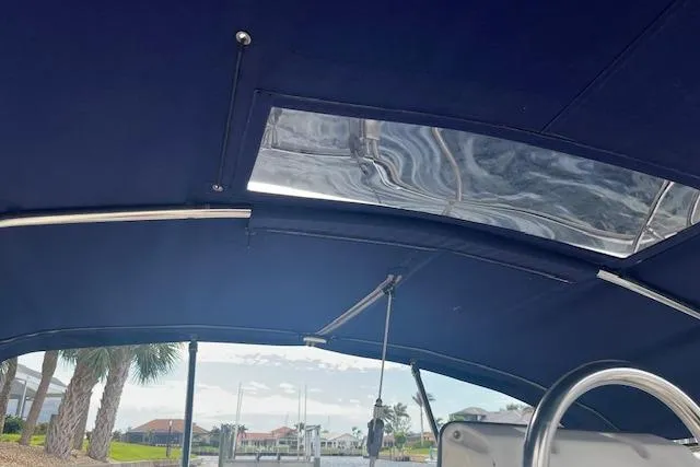 Slide: The Image of Interior view of 1989 Sabre 30 MKIII sailboat with blue canopy and clear window. - 3