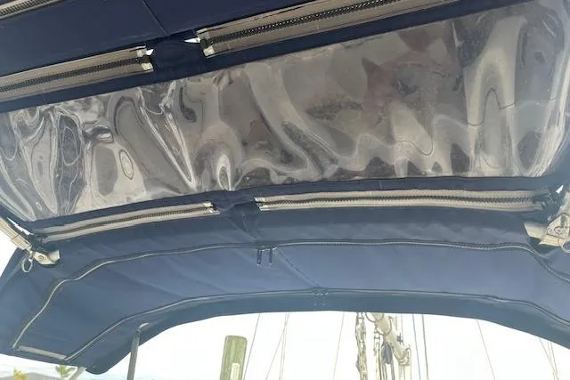 Slide: The Image of Blue canvas bimini top with clear panels on a 1989 Sabre 30 MKIII sailboat. - 4