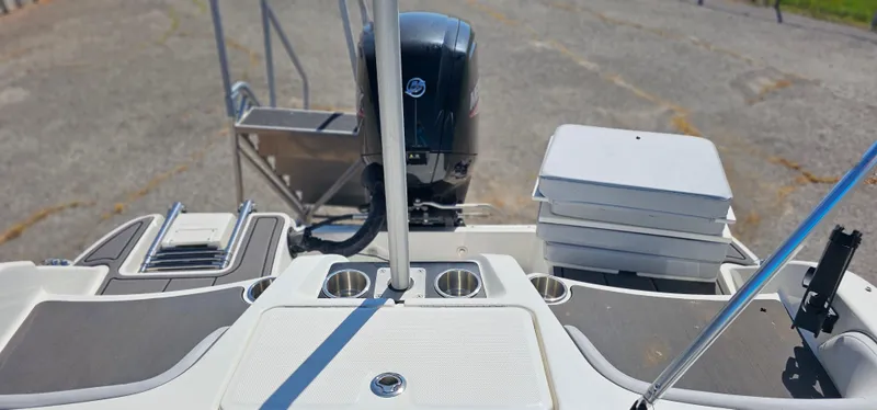 Slide: The Image of 2024 Bayliner Element M17 boat interior with motor and seating area. - 14