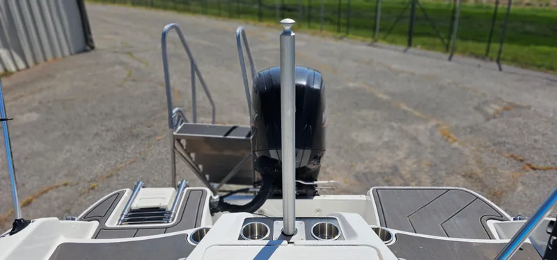 Slide: The Image of 2024 Bayliner Element M17 boat stern with motor and swim ladder. - 15