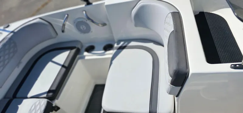 Slide: The Image of 2024 Bayliner Element M17 boat interior with cushioned seating and speaker. - 7