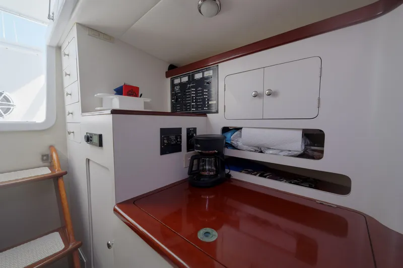 Slide: The Image of Interior of 1998 Gamefisherman Enticer boat with wooden counter and coffee maker. - 21