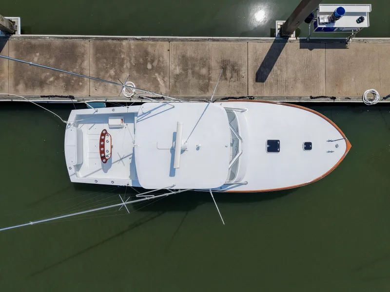 Slide: The Image of Overhead view of 1998 Gamefisherman Enticer boat docked at marina. - 43