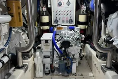 Slide: The Image of Engine room of 1998 Gamefisherman 34 Express boat with control panel and machinery. - 45