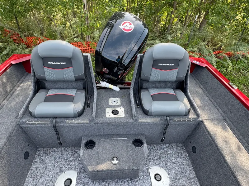 Slide: The Image of 2025 Tracker Pro Guide V-175 Combo boat interior with dual seats and motor. - 6