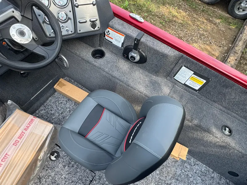 Slide: The Image of Interior of 2025 Tracker Pro Guide V-175 Combo boat with steering wheel and seat. - 9
