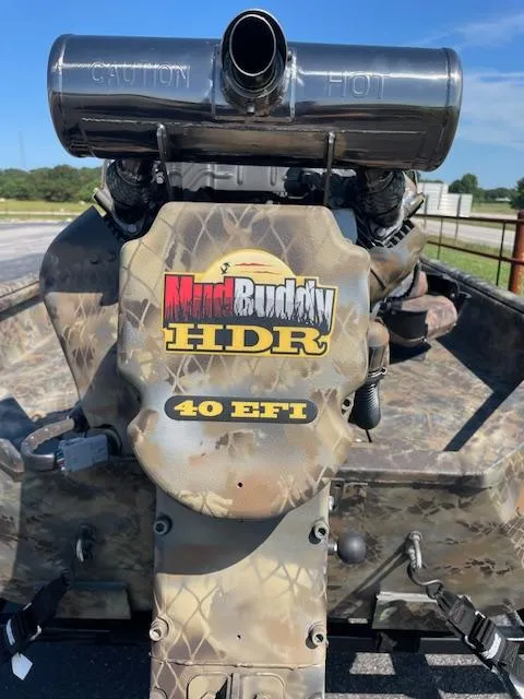 Slide: The Image of MudBuddy HDR 40 EFI engine on Excel Eclipse 2025 boat, camo design, outdoor setting. - 4