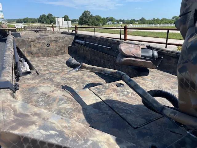 Slide: The Image of 2025 Excel Eclipse boat interior with camouflage design, featuring spacious seating and storage. - 5