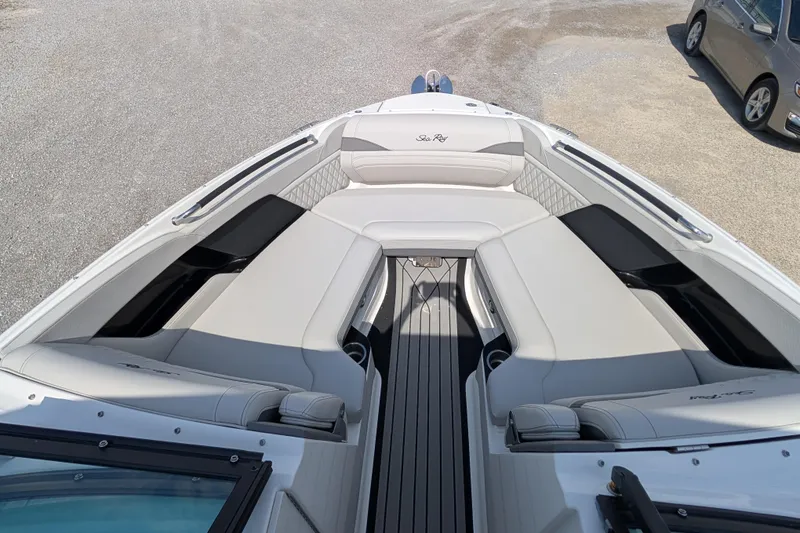 Slide: The Image of 2025 Sea Ray SLX 260 Surf boat interior with luxurious seating and sleek design. - 11