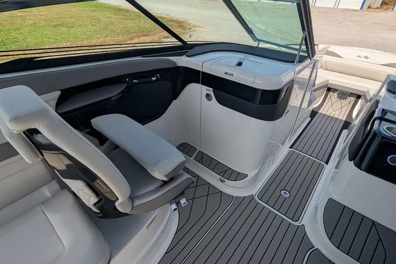 Slide: The Image of 2025 Sea Ray SLX 260 Surf boat interior with sleek seating and modern dashboard design. - 23