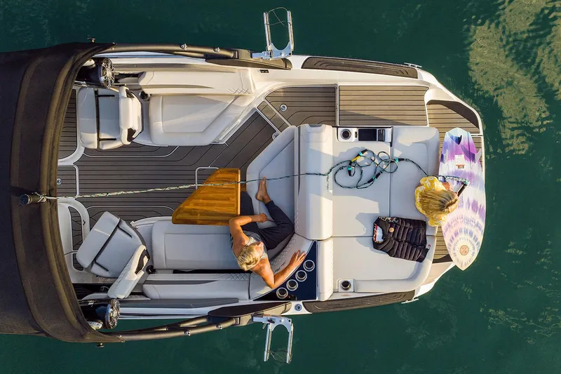 Slide: The Image of Manufacturer Provided Image: Aerial view of 2025 Sea Ray SLX 260 Surf boat with passengers relaxing. - 30