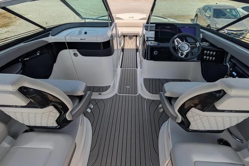 Slide: The Image of 2025 Sea Ray SLX 260 Surf boat interior with modern helm and seating. - 9