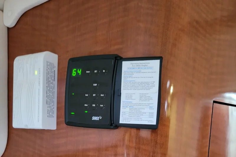 Slide: The Image of SMXir control panel on 2003 Sea Ray 320 Sundancer boat interior. - 11