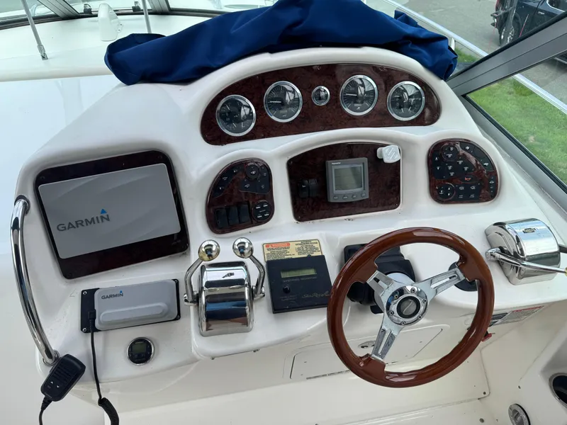 Slide: The Image of Dashboard of a 2003 Sea Ray 320 Sundancer with Garmin navigation system. - 22