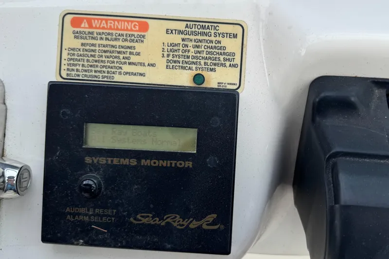 Slide: The Image of Control panel of 2003 Sea Ray 320 Sundancer with warning and systems monitor. - 24