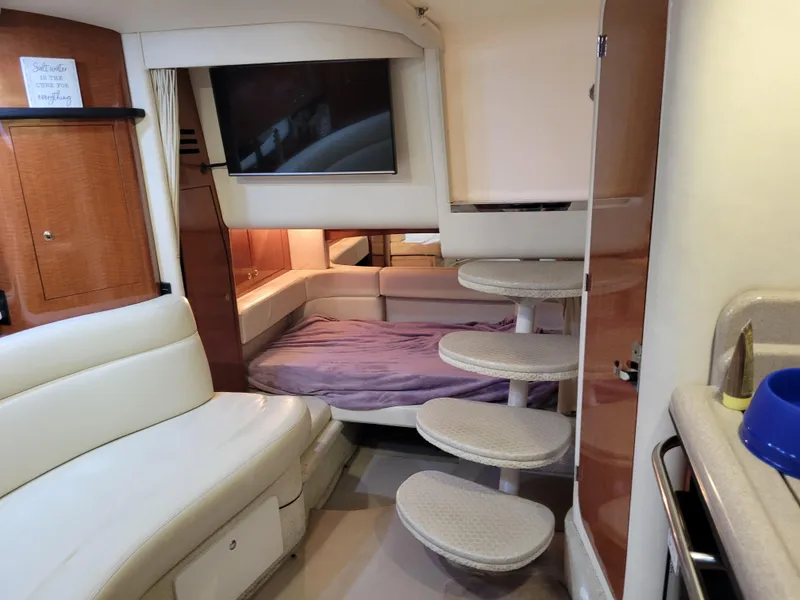 Slide: The Image of Interior of 2003 Sea Ray 320 Sundancer yacht with cozy seating and modern amenities. - 6