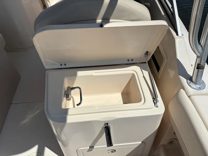 Slide: The Image of Open storage compartment on 2011 Grady-White Freedom 275 boat. - 15