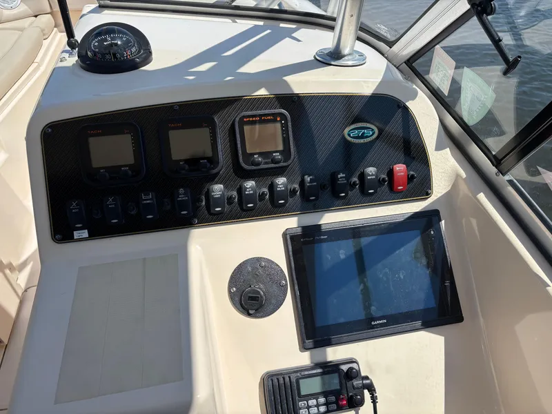 Slide: The Image of Dashboard of 2011 Grady-White Freedom 275 boat with navigation instruments and controls. - 8