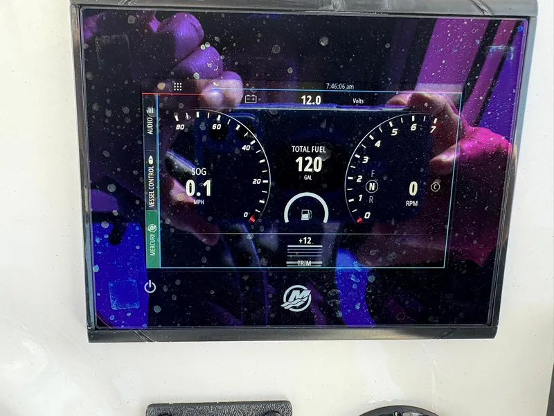 Slide: The Image of Dashboard display of a 2023 Caymas 28 HB boat showing speed, fuel, and RPM. - 14