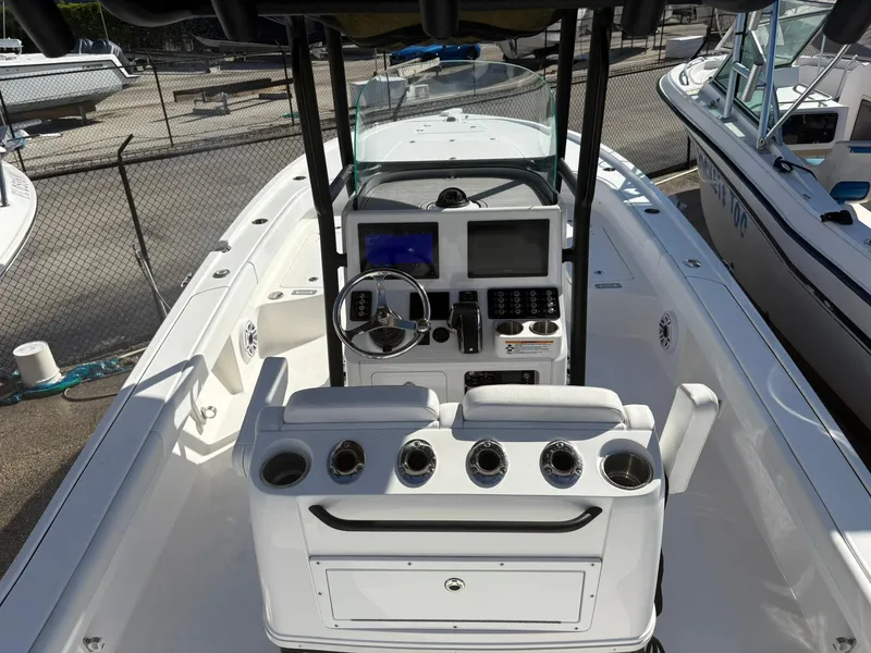 Slide: The Image of 2023 Caymas 28 HB boat interior with modern helm and seating. - 9