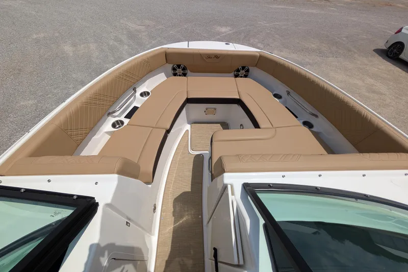 Slide: The Image of Luxurious 2025 Sea Ray SDX 250 boat interior with tan seating and cup holders. - 14