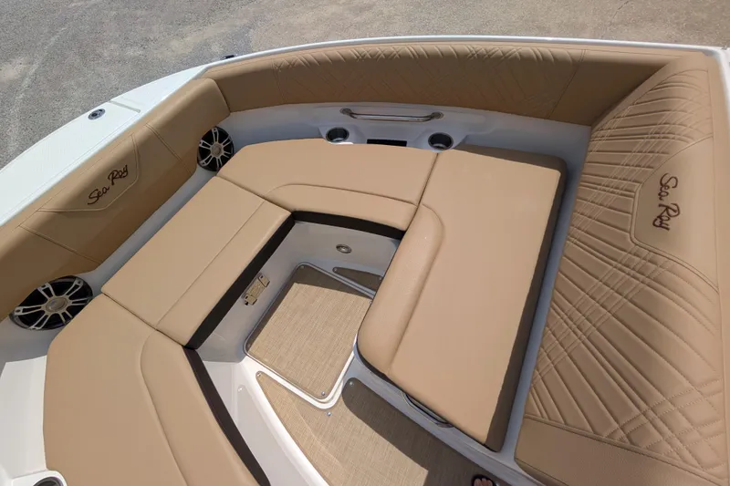 Slide: The Image of 2025 Sea Ray SDX 250 boat interior with tan seating and branded embroidery. - 17