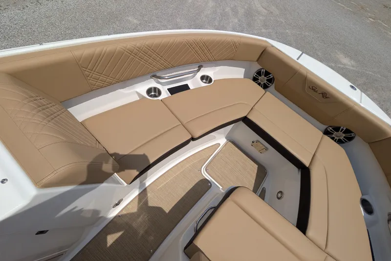 Slide: The Image of Luxurious seating area on 2025 Sea Ray SDX 250 boat with tan upholstery and speakers. - 18