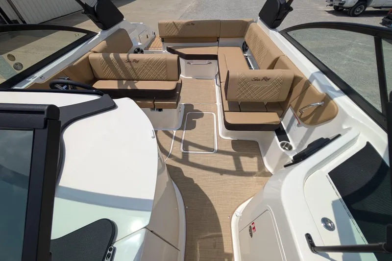 Slide: The Image of Interior of 2025 Sea Ray SDX 250 boat with tan seating and modern design. - 19