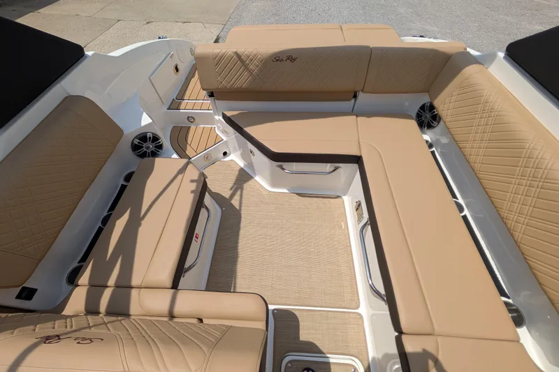 Slide: The Image of 2025 Sea Ray SDX 250 boat interior with tan seating and stylish design. - 20