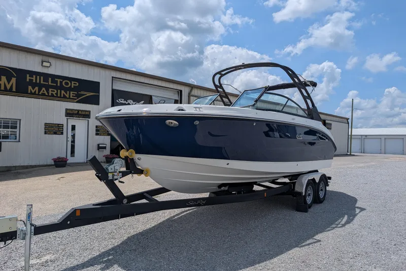 Slide: The Image of 2025 Sea Ray SDX 250 boat on trailer at Hilltop Marine dealership. - 4
