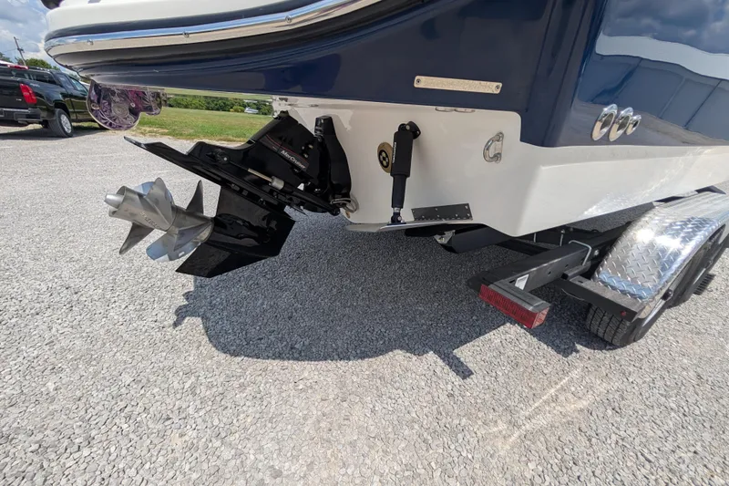 Slide: The Image of Rear view of 2025 Sea Ray SDX 250 boat with propeller and trailer. - 40