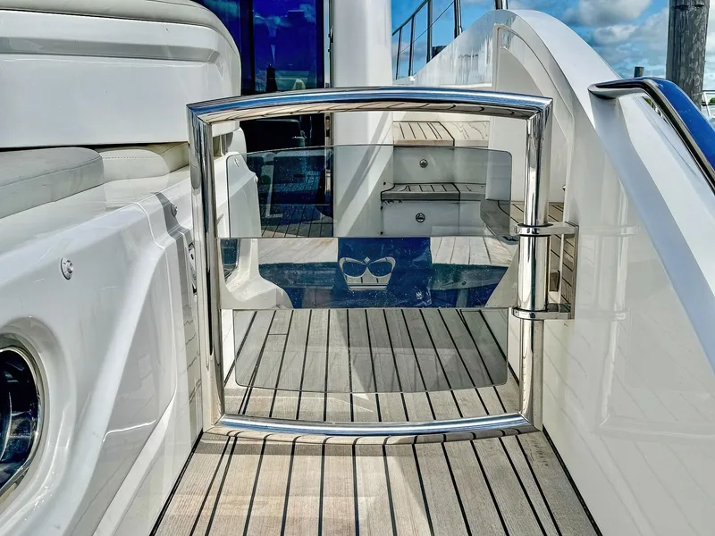 Slide: The Image of Luxury yacht Princess S60, 2018 model, featuring sleek deck design and chrome accents. - 12