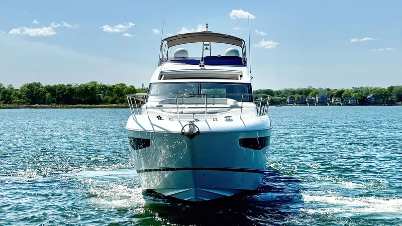 Slide: The Image of 2018 Princess S60 yacht cruising on a sunny day, surrounded by calm blue waters. - 2