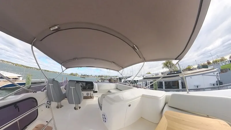 Slide: The Image of 2018 Princess S60 yacht with spacious deck and canopy, docked at marina. - 26