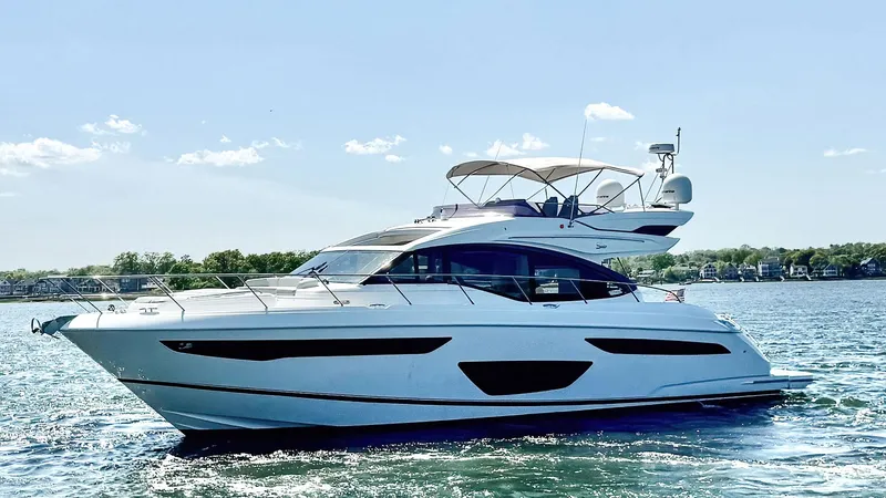 Slide: The Image of 2018 Princess S60 yacht cruising on a sunny day, showcasing sleek design and luxury. - 3