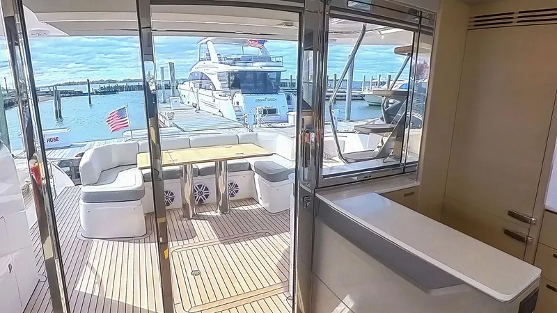 Slide: The Image of Luxurious 2018 Princess S60 yacht interior with spacious deck and marina view. - 31