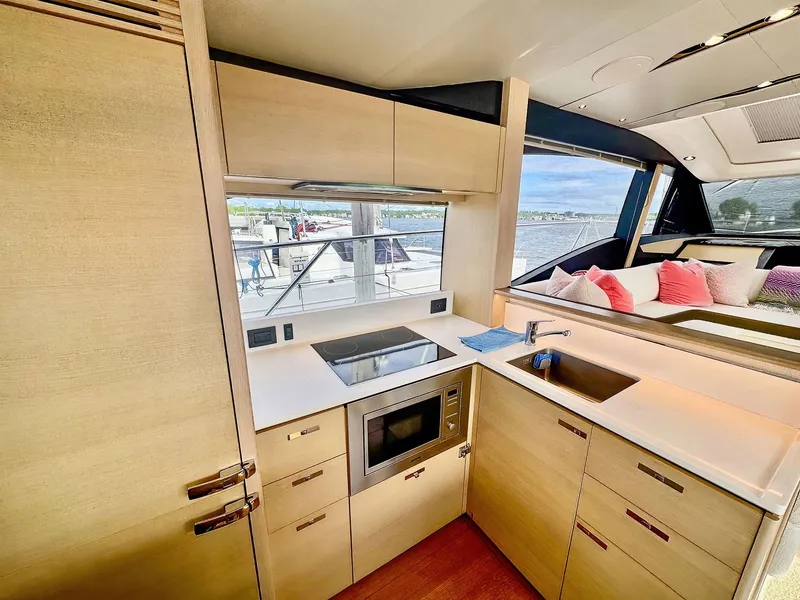 Slide: The Image of Modern kitchen interior on a 2018 Princess S60 yacht with sleek cabinetry and appliances. - 33