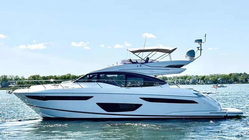 Slide: The Image of 2018 Princess S60 yacht cruising on a sunny day, showcasing sleek design and luxury. - 4
