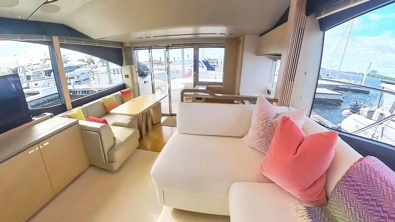 Slide: The Image of Luxurious 2018 Princess S60 yacht interior with plush seating and marina view. - 42