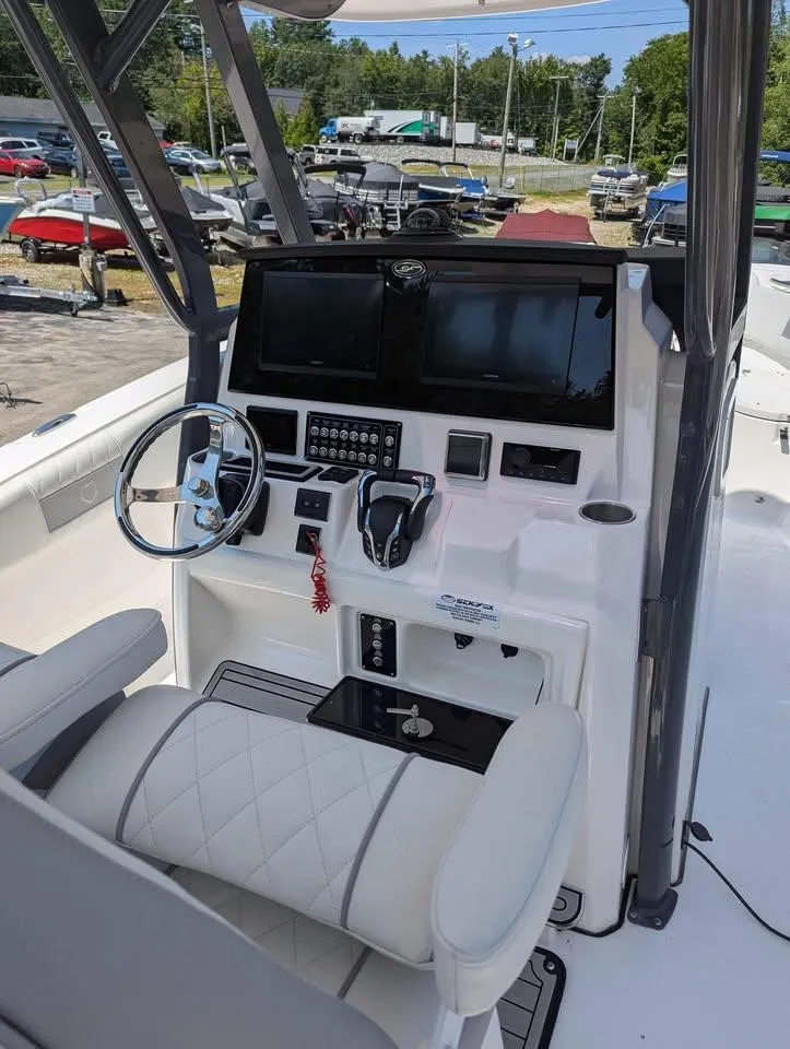 Slide: The Image of 2024 Sea Fox 288 Commander boat cockpit with modern controls and dual screens. - 10