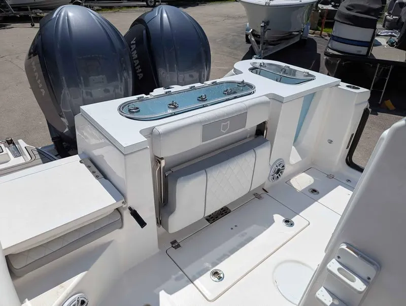 Slide: The Image of 2024 Sea Fox 288 Commander boat interior with Yamaha engines and seating area. - 18