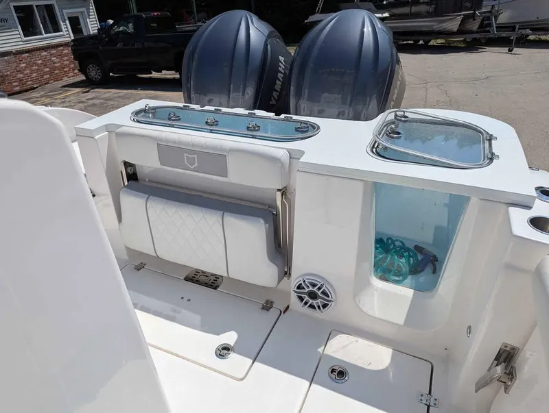 Slide: The Image of 2024 Sea Fox 288 Commander boat interior with dual Yamaha engines and storage compartments. - 19
