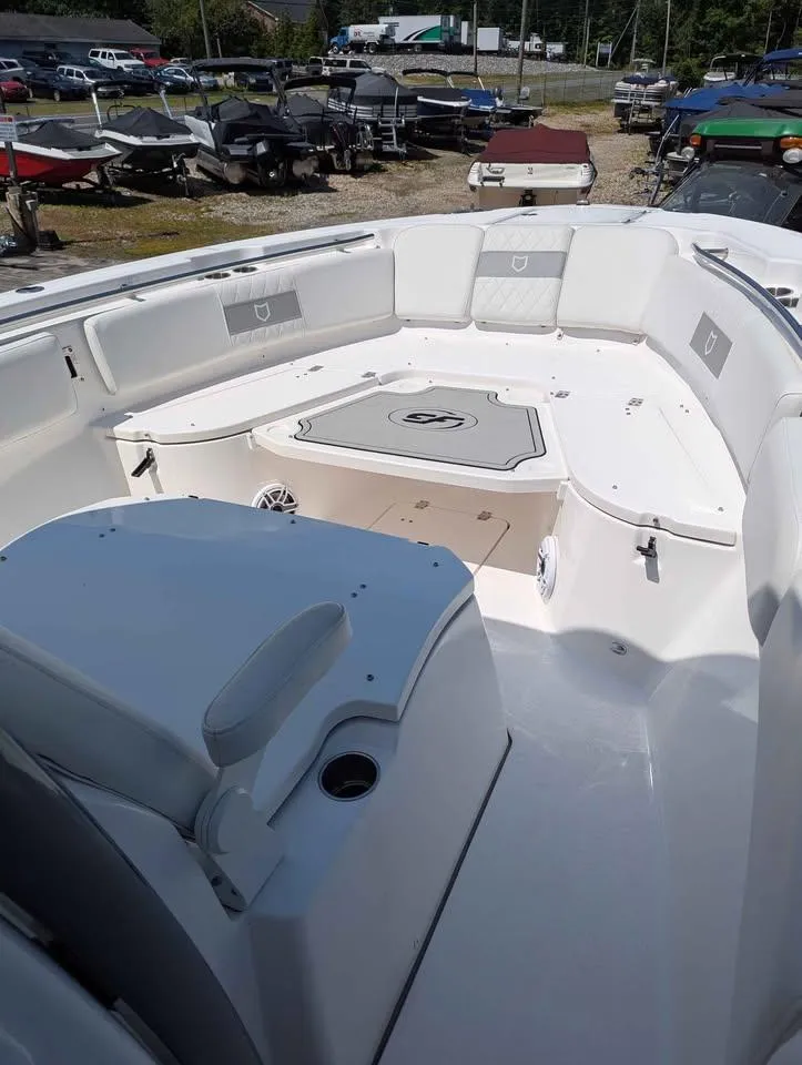 Slide: The Image of 2024 Sea Fox 288 Commander boat interior with spacious seating and storage. - 21
