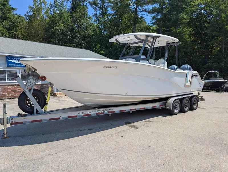 Slide: The Image of 2024 Sea Fox 288 Commander boat on trailer, parked outdoors near trees. - 5